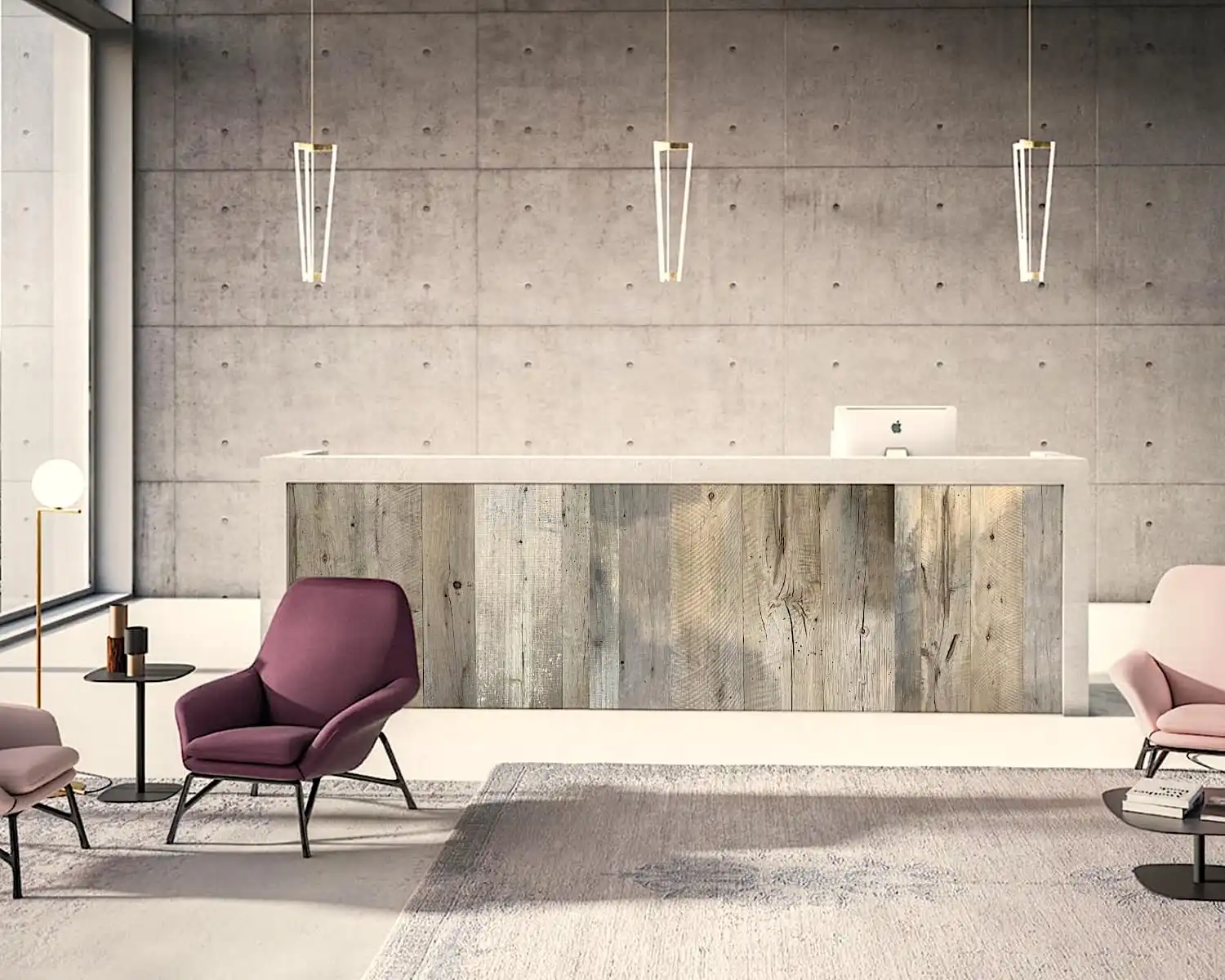 Un espace de réception moderne avec des chaises roses et un mur en béton et un comptoir en planches bois vieilli