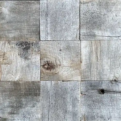  Une image en gros plan d'un mur en bois vieilli avec des carrés de bois. 