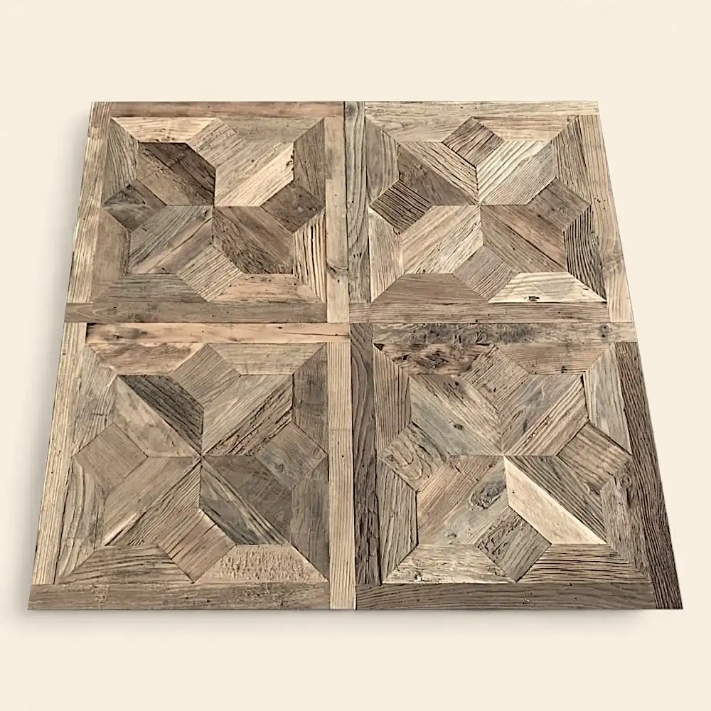  Quatre dalles de parquet en bois sont disposées selon une grille 2x2. Chaque carreau, faisant partie de la collection Parquet Etoile, présente un motif géométrique composé de différentes nuances de bois brun, créant un effet d'illusion 3D. 