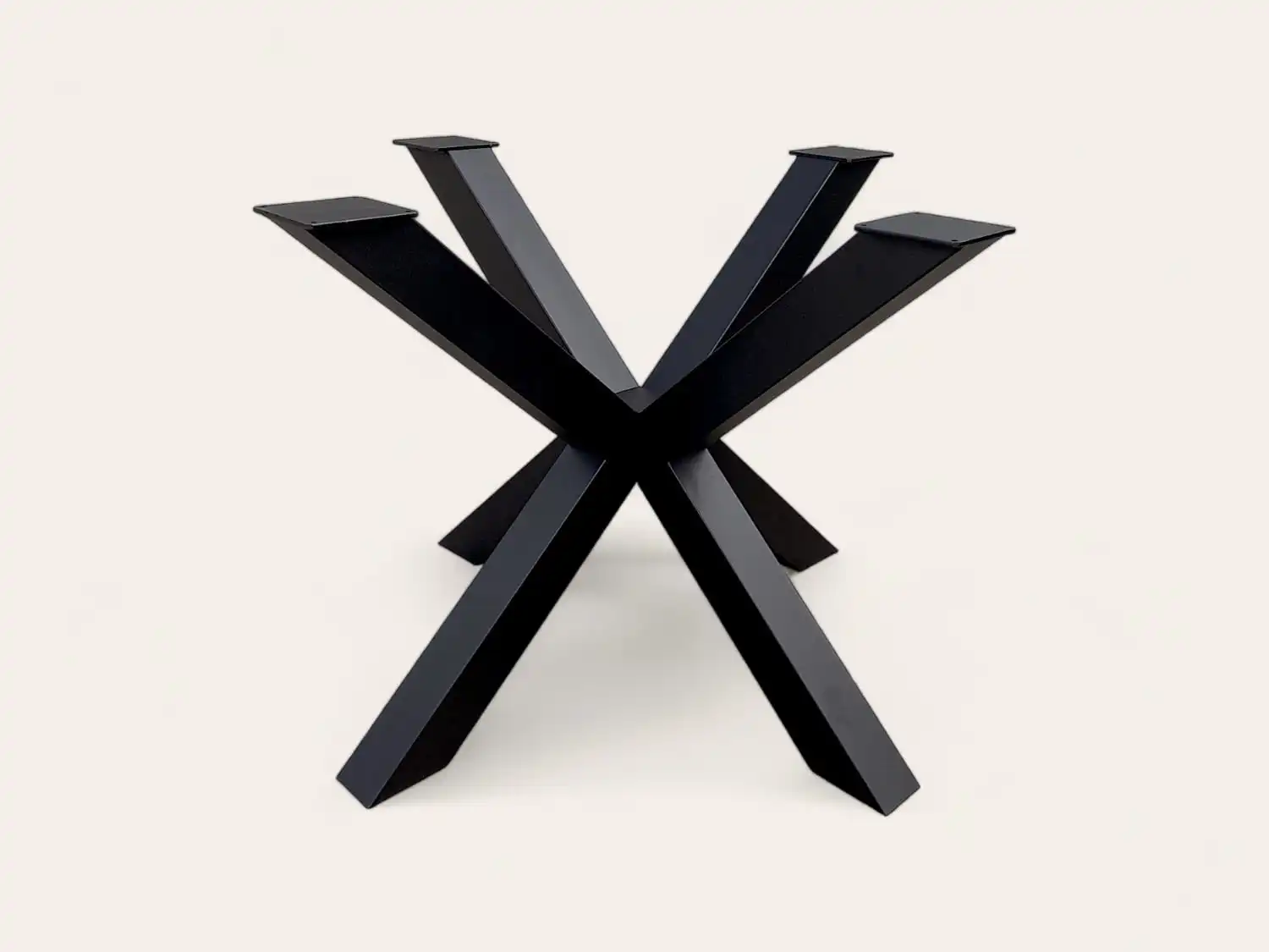 Base de table noire avec un design symétrique en forme de X sur un fond clair.