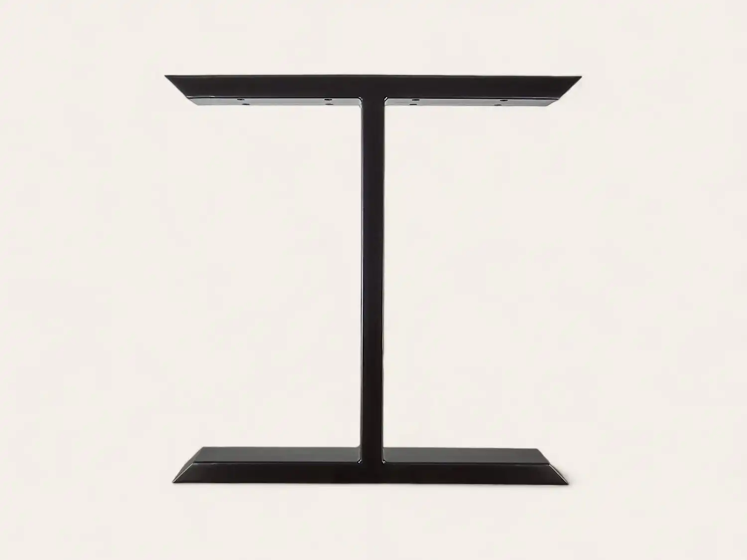 Pied de table moderne en forme de T noir sur fond blanc.