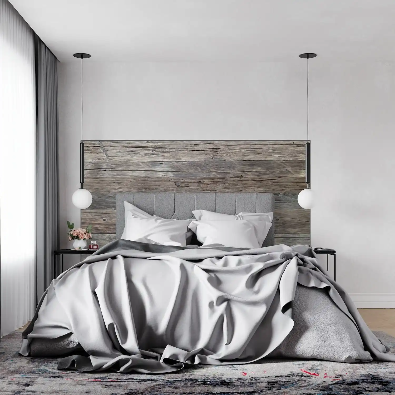  Une chambre moderne avec un grand lit, une literie grise, des suspensions et une tête de lit en bois rustique. 